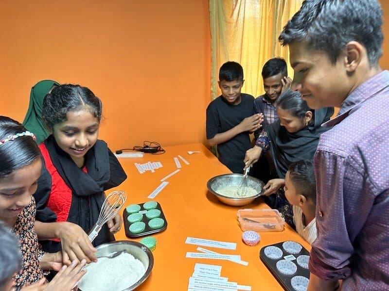 English class making cupcakes